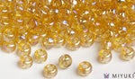 Miyuki 6/0 glass seed beads in the color 251 Transparent Pale Gold AB