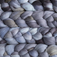 Malabrigo Nube unspun merino top hand dyed in the color Plomo (greys with a brown tint)