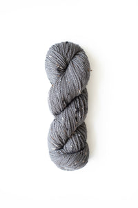 Woolfolk Fleck Yarn in the colorway F6 Gray tweed